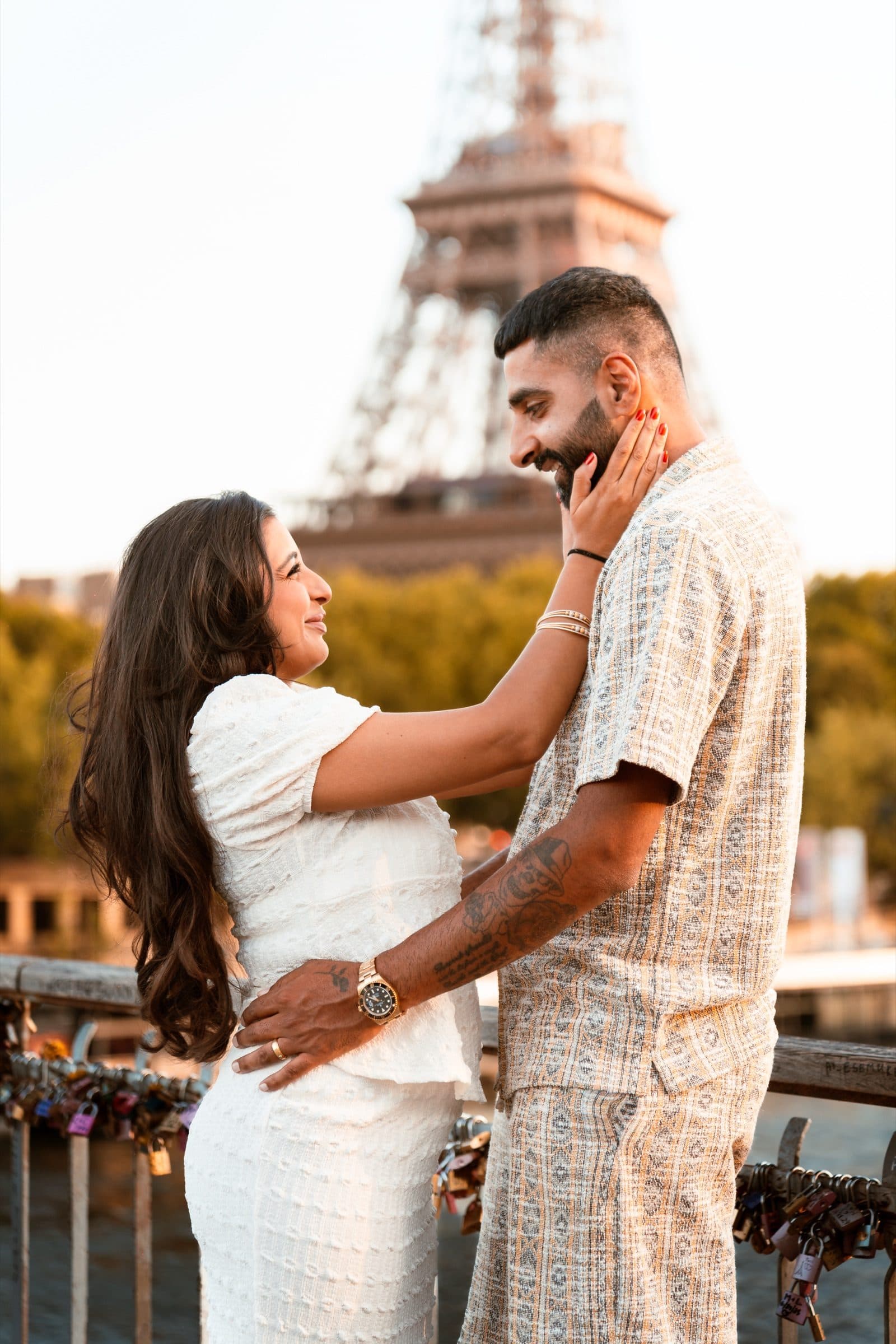 A couple in portrait at the Eiffel Tower