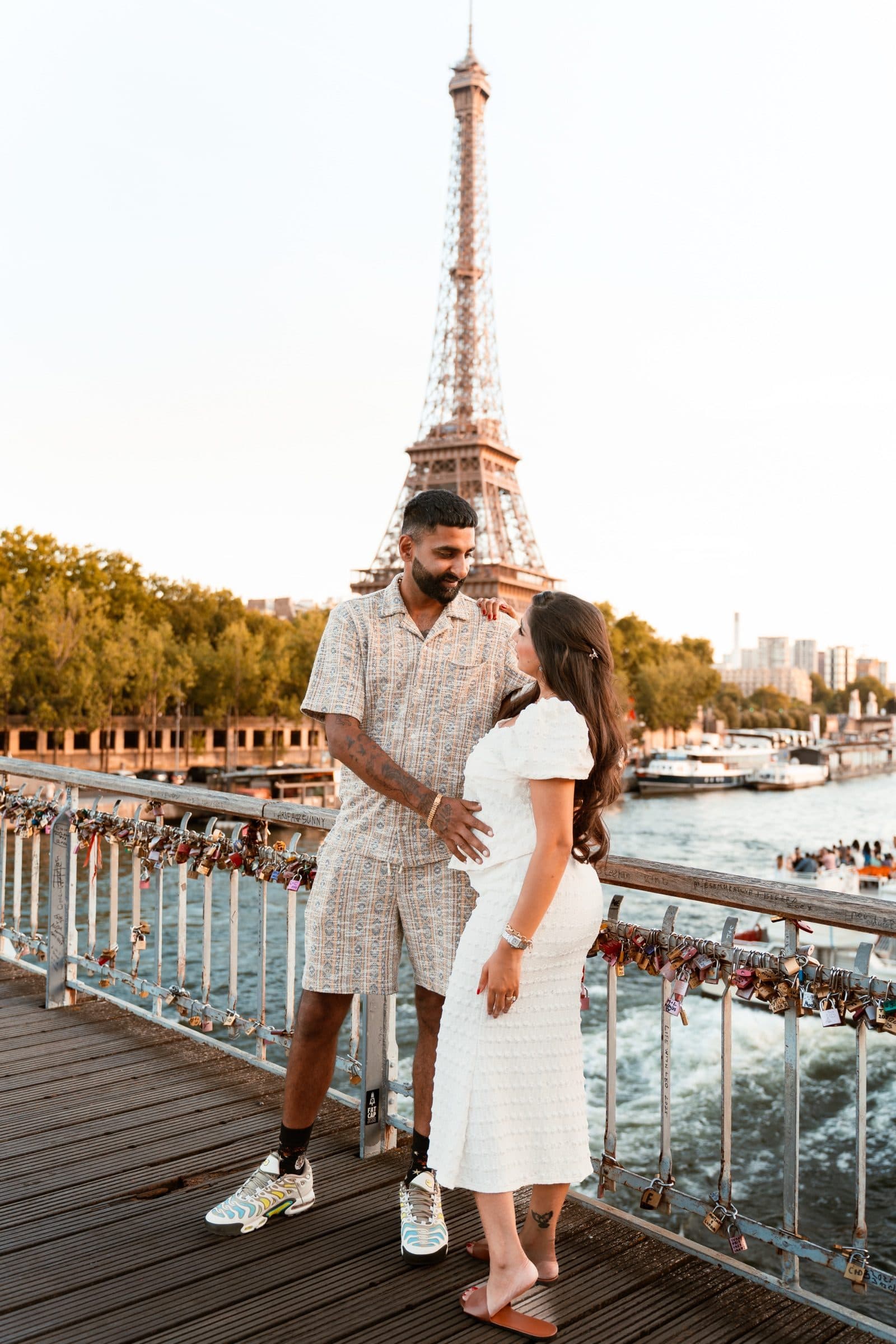 A couple in portrait, at the Eiffel Tower