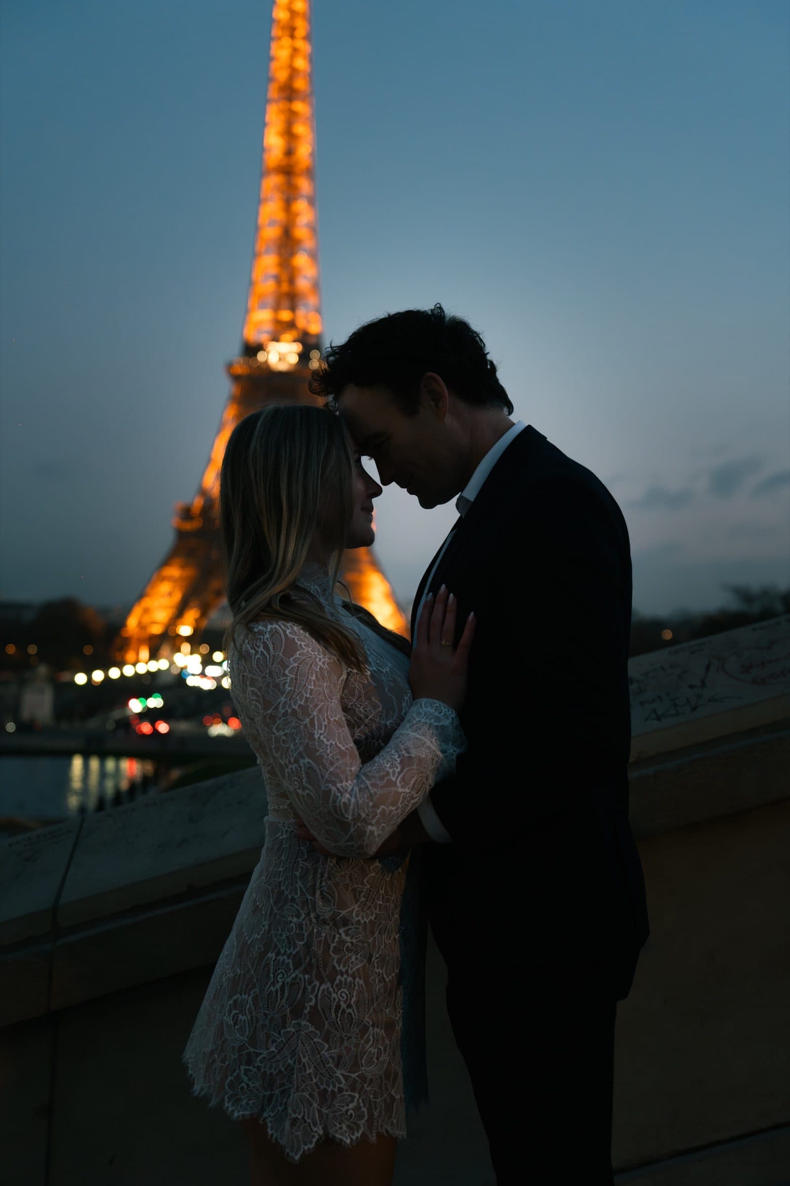 A couple photographed at night, at Trocadéro