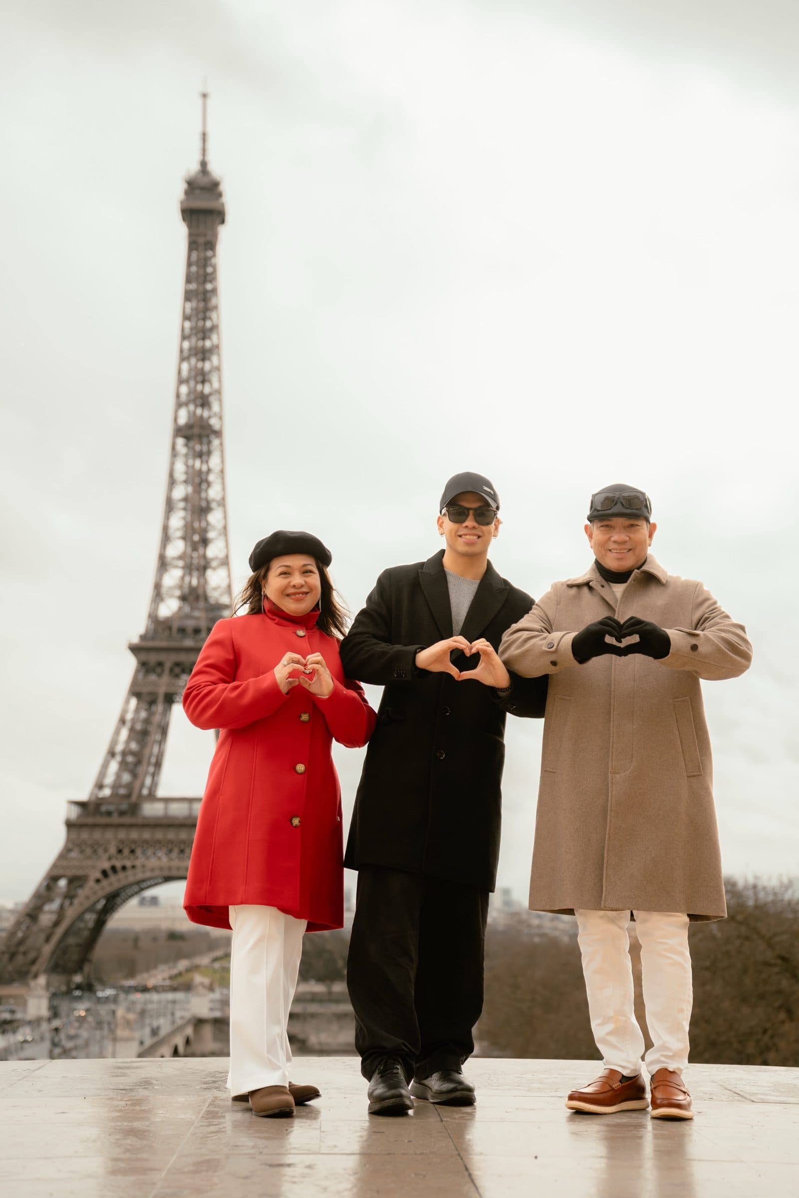 A family photographed at Trocadéro at sunrise