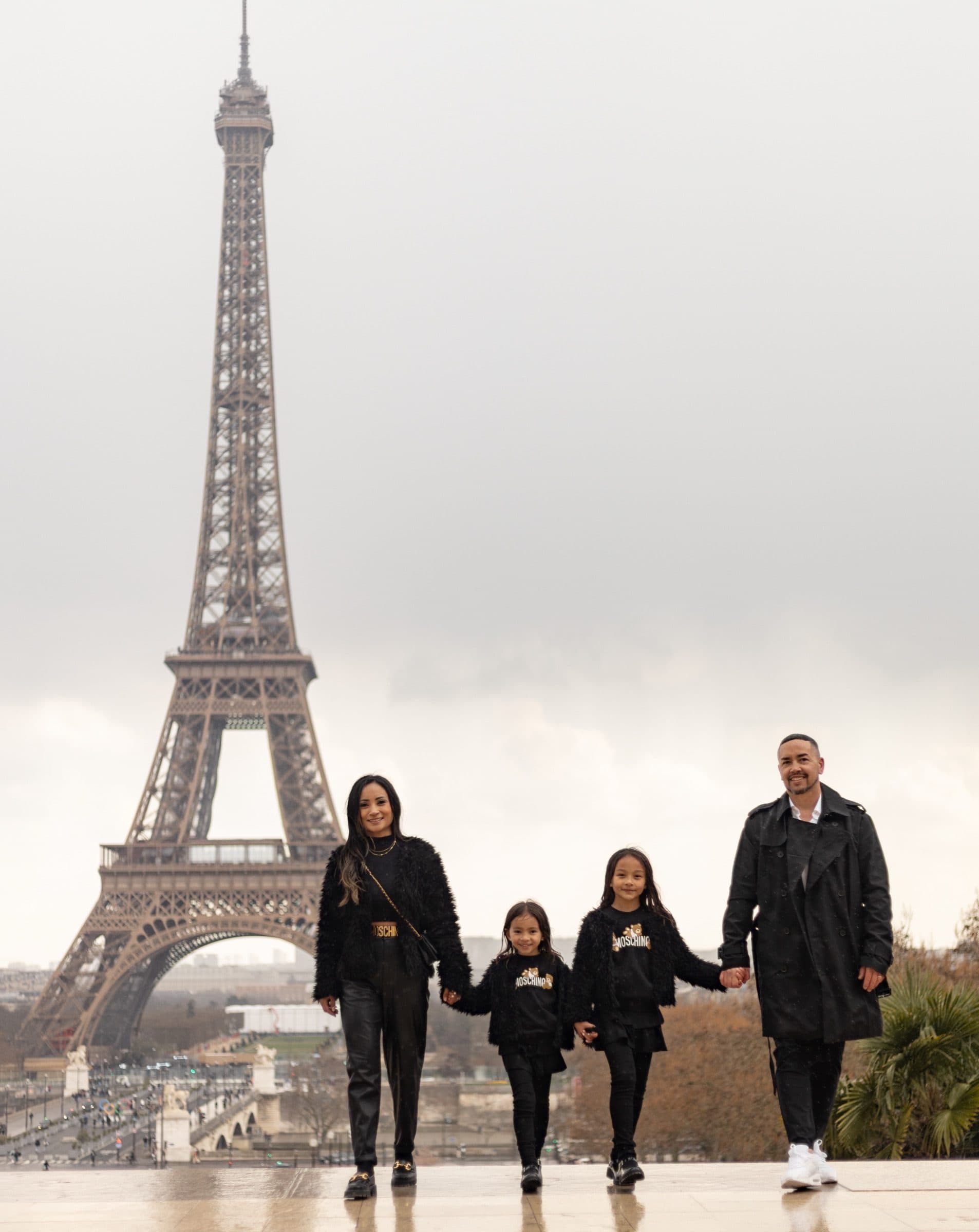 A family photographed at sunrise, at Trocadéro