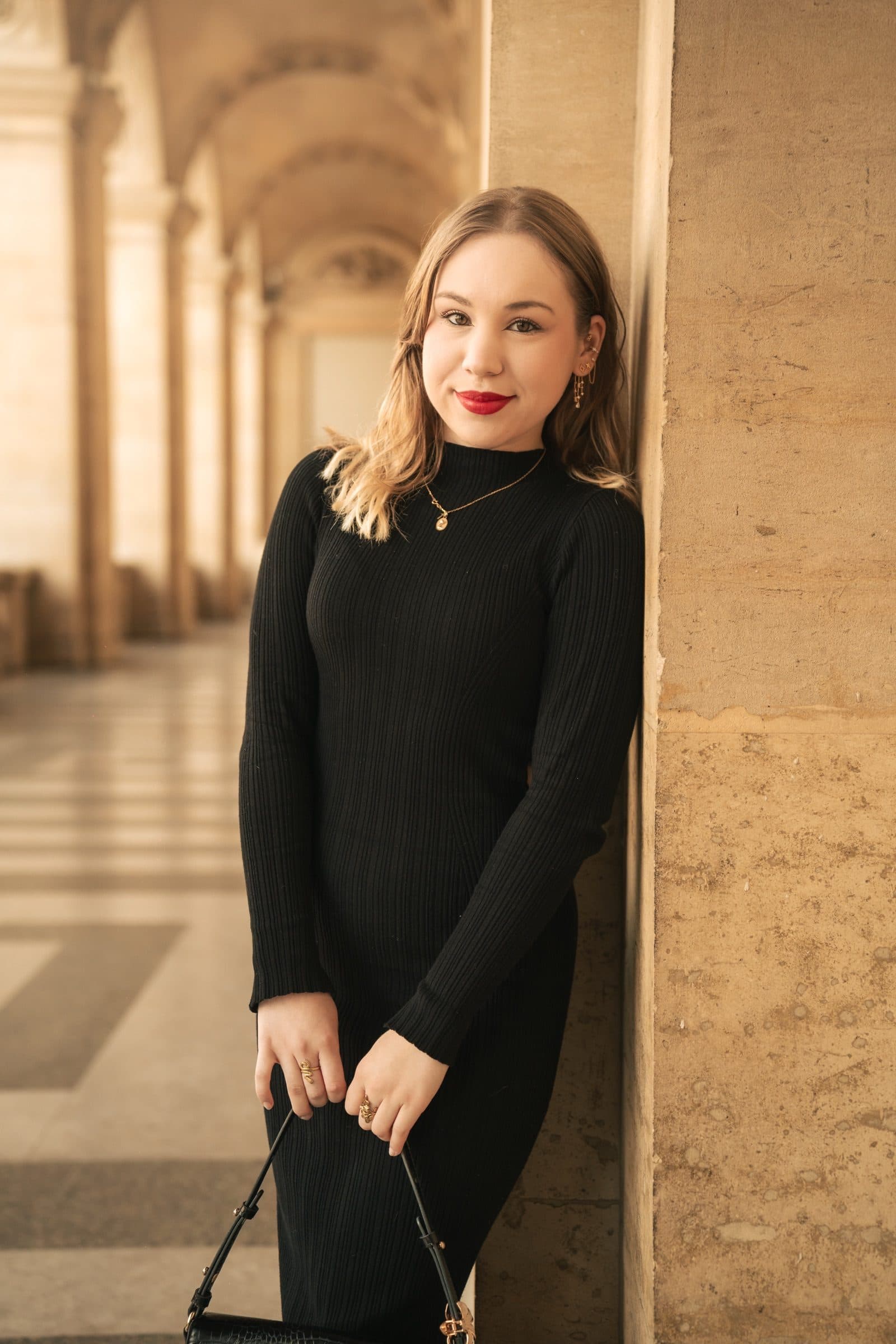 A solo traveller photographed at golden hour, at the Louvre