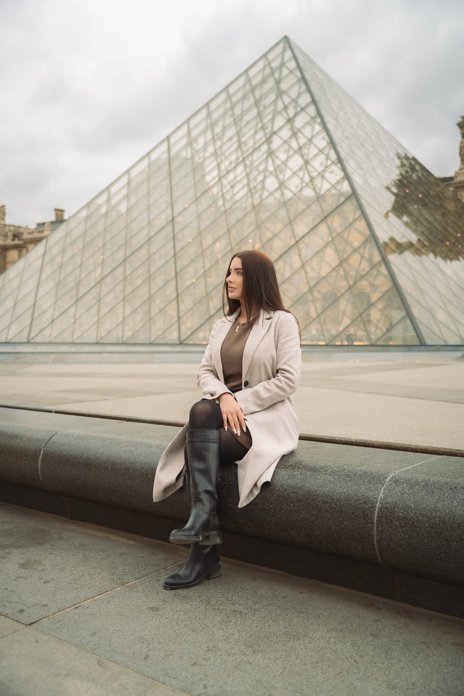 A solo traveller photographed at golden hour, at the Louvre