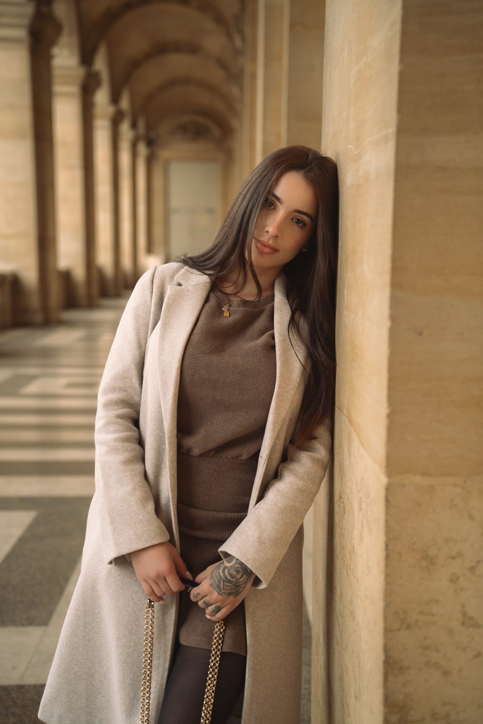 A solo traveller photographed at golden hour, at the Louvre