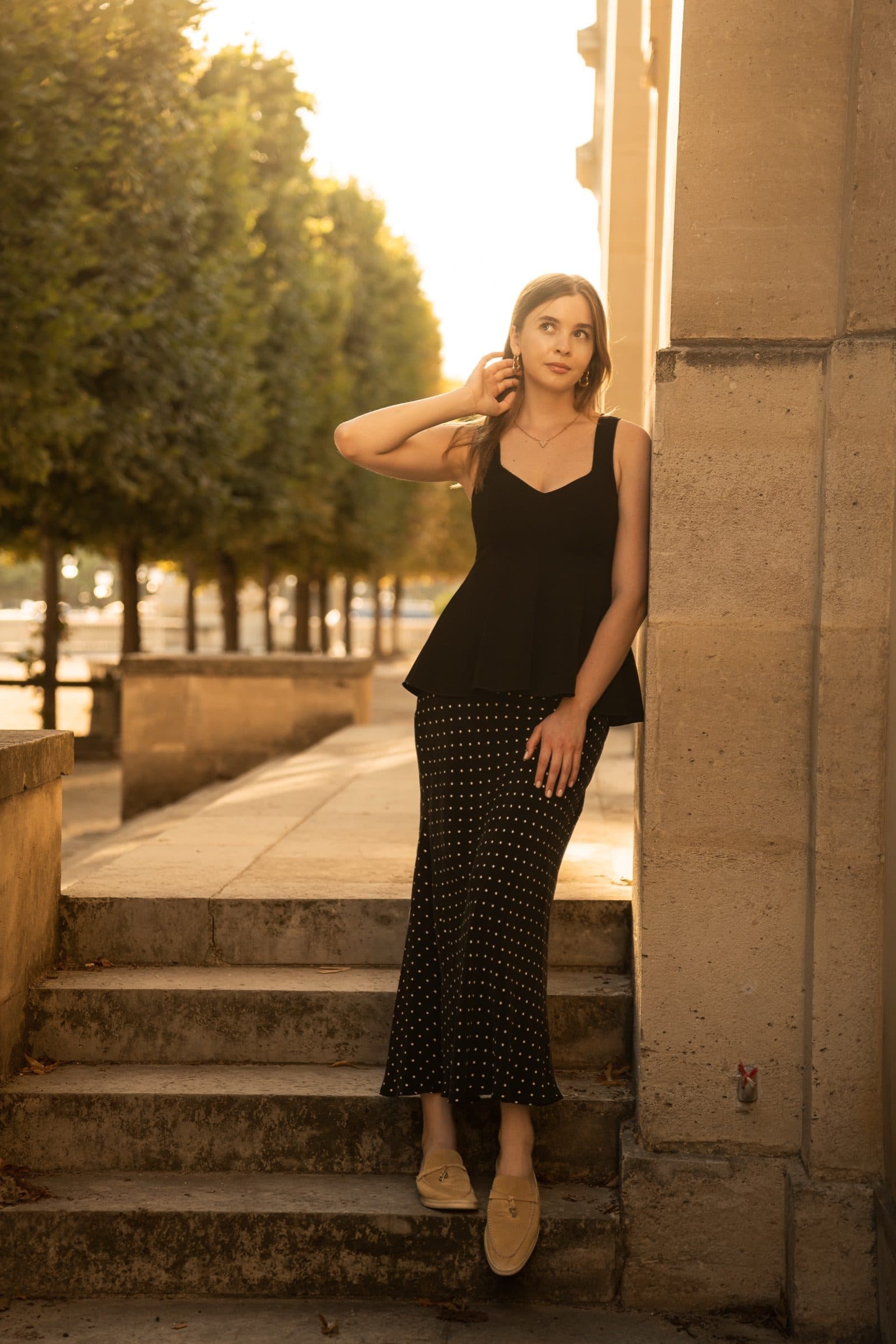A solo traveller photographed at the Tuileries at golden hour