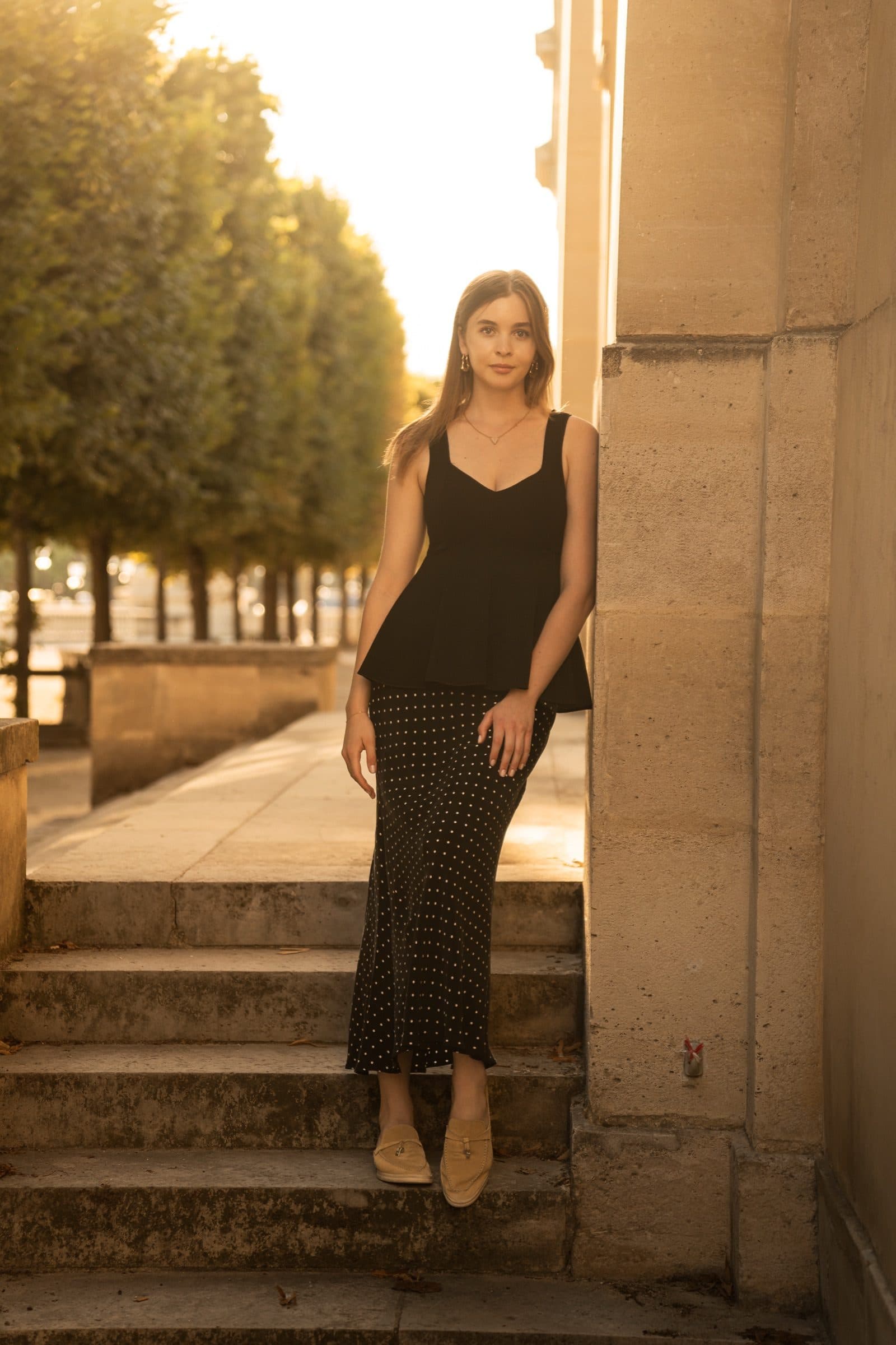 A solo traveller photographed at golden hour, at the Tuileries