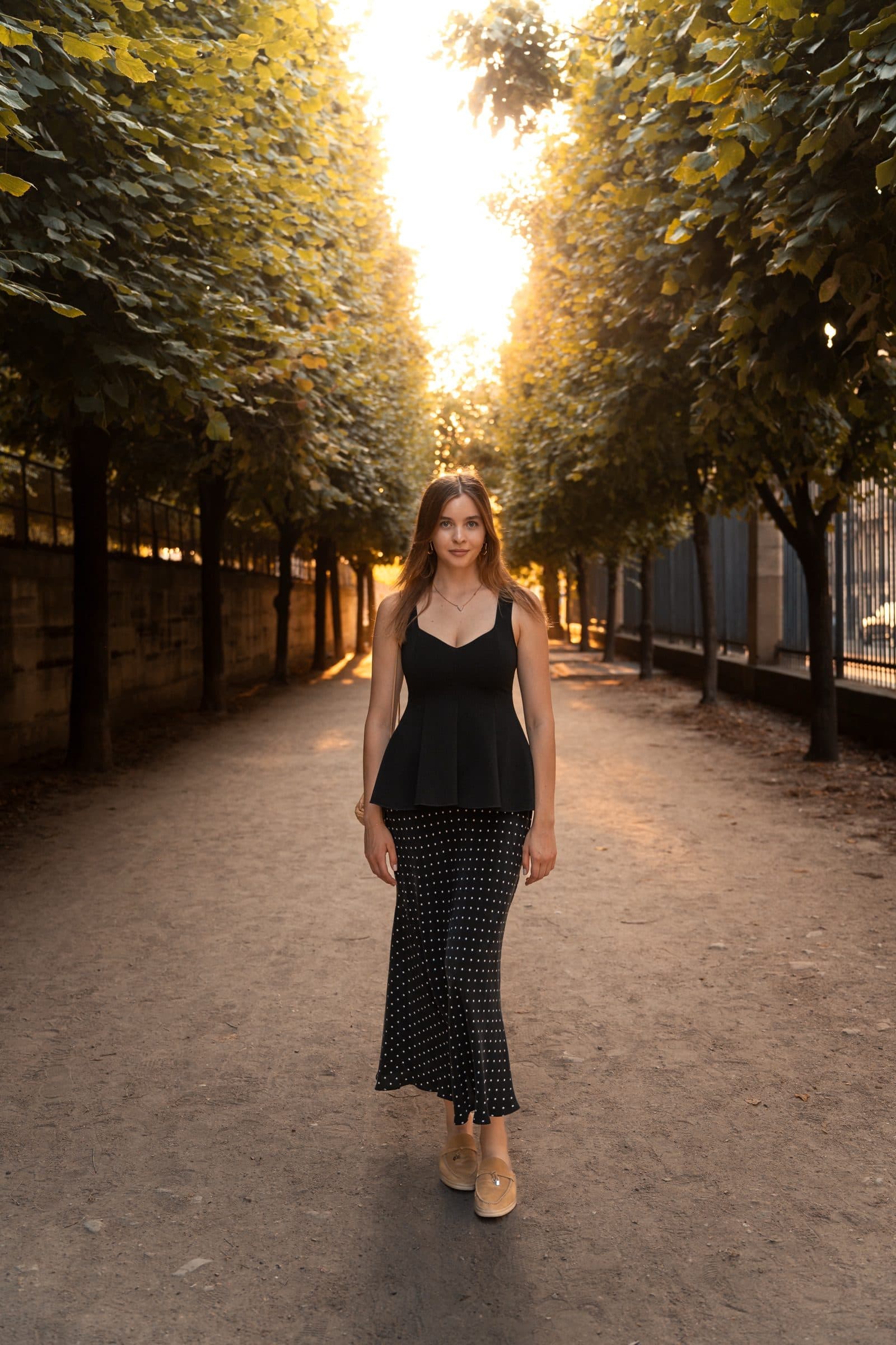 A solo traveller photographed at golden hour, at the Tuileries